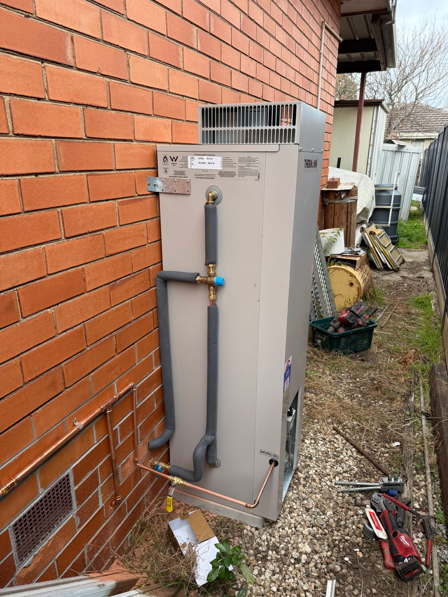 New large storage hot water system installed on brick wall in Sunshine Melbourne